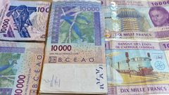 CFA banknotes issued by the  Central Bank of West African States -- but the currency's pegging to the euro is controversial and  politically sensitive, prompting moves to introduce a new currency, the eco