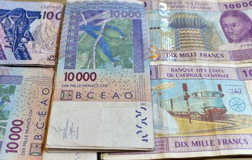 CFA banknotes issued by the  Central Bank of West African States -- but the currency's pegging to the euro is controversial and  politically sensitive, prompting moves to introduce a new currency, the eco