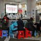 Medical facilities in the Chinese city of Wuhan are swamped with patients waiting for hours to see doctors