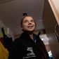 Greta Thunberg wore an oversized black windbreaker emblazoned with the words "Unite Behind The Science" as heavy, freezing rain pounded the hull of the sailboat she is traveling on to Europe