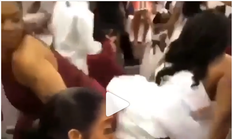 Overexcited bride displays her underwear in a crazy twerking at wedding reception