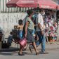 Two people in the Haitian capital Port-au-Prince wear face masks while shopping; a first coronavirus victim has died in Haiti, the government said on April 5, 2020
