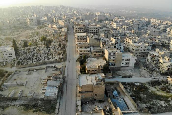 A drone picture shows empty streets and damaged buildings in Maaret Al-Numan in northwestern Idlib, where regime forces have seized dozens of towns and villages in recent violent clashes