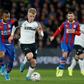 Ghana striker Jordan Ayew (L) vies with Derby County's English midfielder Louie Sibley during Crystal Palace's surprise FA Cup defeat