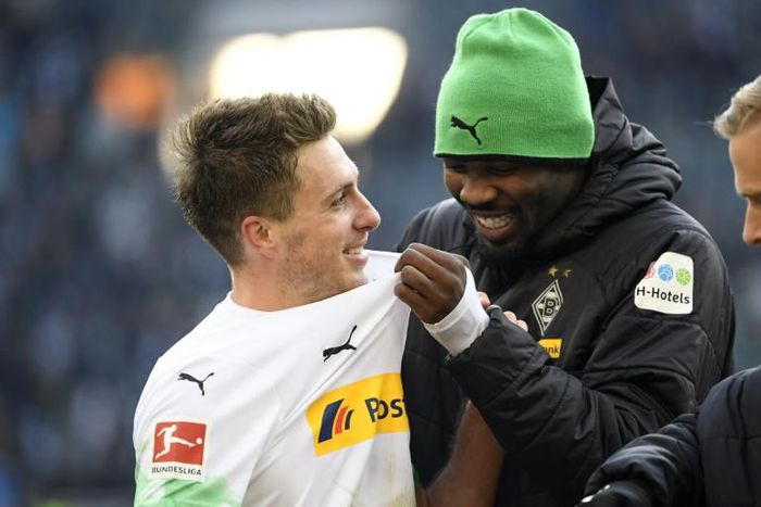Moenchengladbach forwards Marcus Thuram (R) and  Patrick Herrmann (L) celebrate after their 3-1 win over Werder Bremen in their last Bundesliga game nearly two weeks ago.