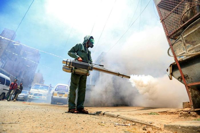 A worker fumigates a neighbourhood in Yemen's Huthi rebel-held capital Sanaa as part of safety precautions during the coronavirus pandemic on March 23