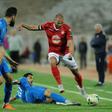A file photo of Etoile Sahel midfielder Yassine Chikhaoui (R), whose goal beat Al Ahly of Egypt in a CAF Champions League Group B match Friday