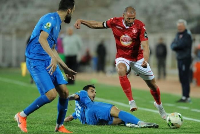 A file photo of Etoile Sahel midfielder Yassine Chikhaoui (R), whose goal beat Al Ahly of Egypt in a CAF Champions League Group B match Friday