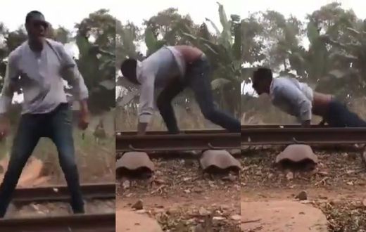 Daring man surprisingly survives after lying on a railway for a speeding train to pass over him (video)