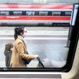 Passengers wear protective masks at Milan's main railway station following security measures taken in northern Italy against  the novel coronavirus. Milan is just north of the main centre of infection.