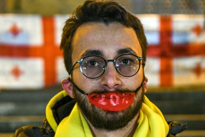 A Georgian opposition supporter attend a rally outside the parliament in central Tbilisi on November 14, 2019