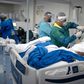 Health professionals check a patient infected with COVID-19 at the Intensive Care Unit (ICU) of the Doctor Ernesto Che Guevara Public Hospital in Marica, Rio de Janeiro state, Brazil, on June 6, 2020