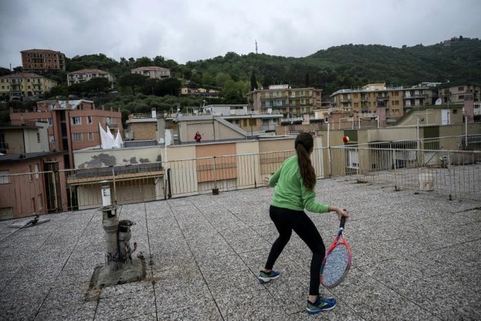 Some Italians have turned their roofs into improvised gyms and even tennis courts in an effort to avoid going stir crazy