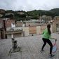 Some Italians have turned their roofs into improvised gyms and even tennis courts in an effort to avoid going stir crazy