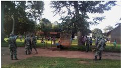 Joint police and military team removes COVID-19 patient from classroom ceiling where he’s been hiding