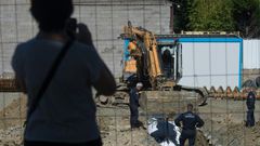 Some 2,300 residents were evacuated as the experts dug a hole around the bomb before cutting it up and taking it away to be destroyed