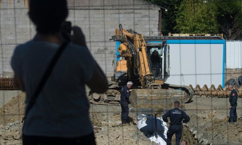 Some 2,300 residents were evacuated as the experts dug a hole around the bomb before cutting it up and taking it away to be destroyed