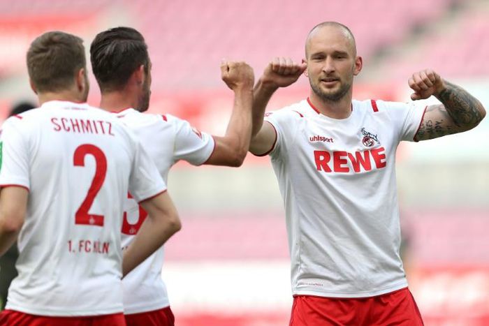 Touch and go: Cologne defender Toni Leistner (right) celebrates with forward Mark Uth