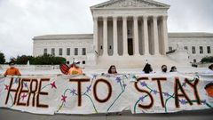 Pro-immigration activists in front of the US Supreme Court after the court upheld the DACA "Dreamers" program offering legal protections to some 700,000 people brought into the country illegally as children