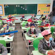 Pupils wear social distancing headgears to class