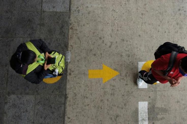 People respecting social distancing measures in Ecuador's capital Quito