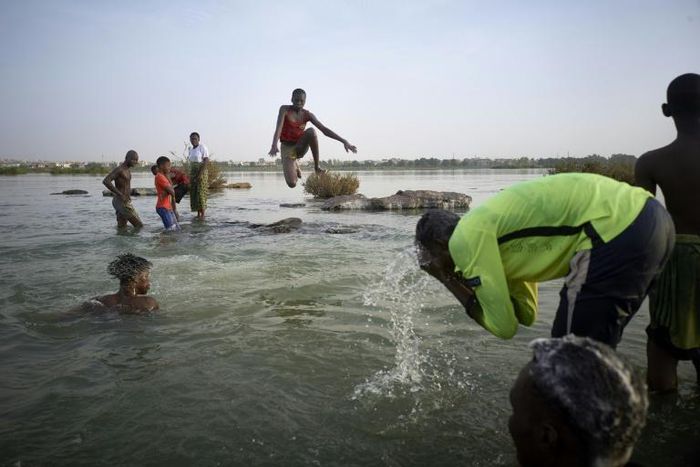Malian children freshen up in the cool waters of the Niger River before breaking the fast