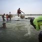 Malian children freshen up in the cool waters of the Niger River before breaking the fast