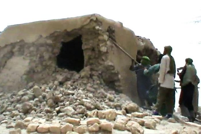 A still from a video shows jihadists destroying an ancient shrine in Timbuktu in 2012