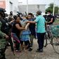 A woman collapses near the drug rehabilitation center where 24 people were killed in Irapuato, Guanajuato state, Mexico, on July 1, 2020
