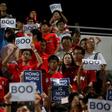 Hong Kong fans hold up signs that read "Boo" in 2015 during China's national anthem before a qualifying match for the 2018 World Cup at Mong Kok stadium in Hong Kong