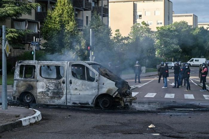 A burned-out van in the Gresilles neighbourhood of Dijon, eastern France, on Monday after a night of clashes.
