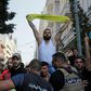 Lebanese army troops form a human chain to separate supporters of Hezbollah from other demonstrators after they clashed during a protest in central Beirut