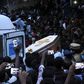 The coffins of J. Jayaraj and Bennicks Immanuel were carried through the crowd in the southern Indian state of Tamil Nadu