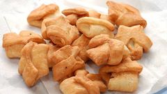 Street Hustle Accra: A day in the life of a widow frying cookies to cater for family
