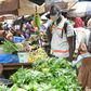 The defiant mood is deepened by the need to make a living. At a Conakry market, the Red Cross spreads the word on fighting the virus