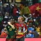 Midfielder Christian Bassogog (L) and assistant coach Sven Vandenbroeck celebrate after Cameroon won the 2017 Africa Cup of Nations final against Egypt in Libreville