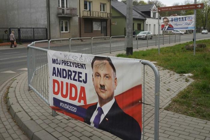 Analysts say the PiS wants the vote to go ahead Sunday because its ally Duda is seen to have better chances of winning sooner rather than later