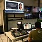 Employees of ABS-CBN work in the editing booth at the station headquarters in Manila on May 6, 2020 before it was forced to shut down