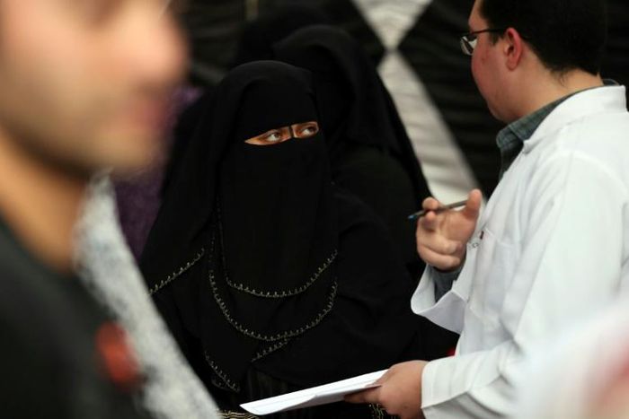 A doctor gives medical advice about female genital mutilation to a woman in Egypt, where the practice is already banned