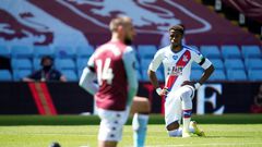 Wilfried Zaha (right)takes a knee prior to Crystal Palace's Premier League match with Aston Villa on Sunday