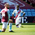 Wilfried Zaha (right)takes a knee prior to Crystal Palace's Premier League match with Aston Villa on Sunday