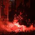 Fans celebrate Liverpool winning the Premier League title outside Anfield