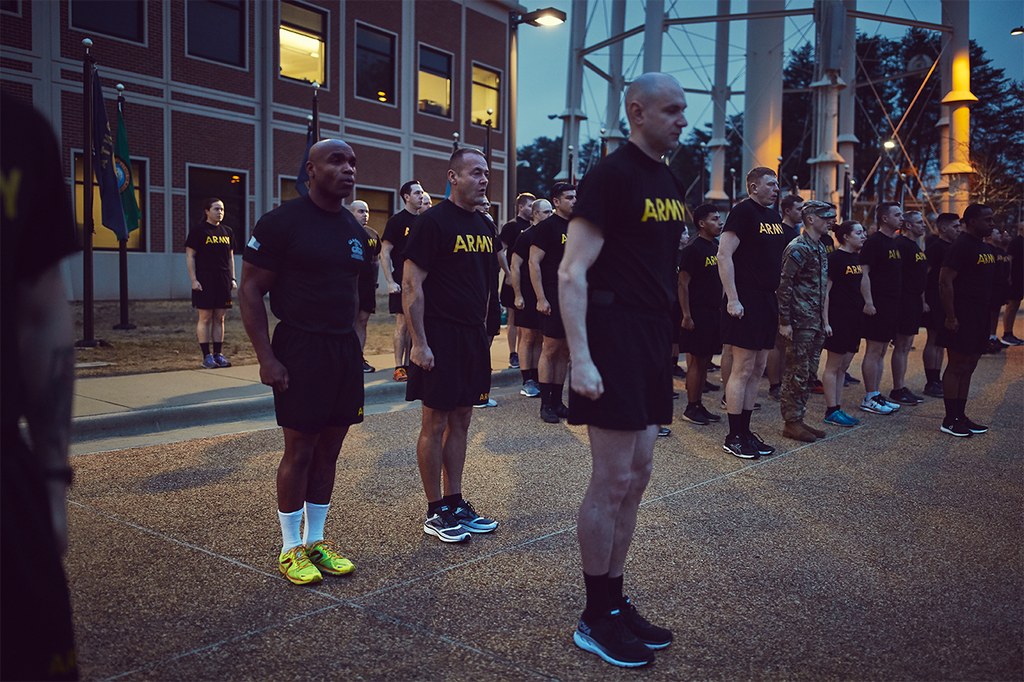 Major Owens stands at attention as the flag is raised at 6:30 a.m. at Fort Bragg in North Carolina.