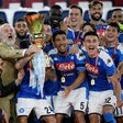 Napoli coach Gennaro Gattuso (L) and club president Aurelio De Laurentiis (3rdL holding trophy) celebrate with players after winning the Italian Cup.
