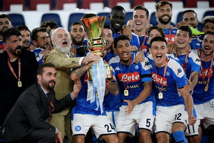 Napoli coach Gennaro Gattuso (L) and club president Aurelio De Laurentiis (3rdL holding trophy) celebrate with players after winning the Italian Cup.