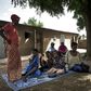 The family of Bakary Sangare, one of the latest victims, gathers in a Fana courtyard