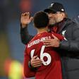 Liverpool manager Jurgen Klopp embraces Reds defender Trent Alexander-Arnold