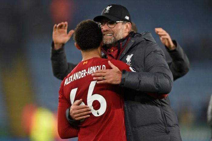 Liverpool manager Jurgen Klopp embraces Reds defender Trent Alexander-Arnold