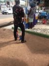 Waakye seller and her customers