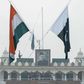 The Indian and Pakistan flags fly during the daily beating of the retreat ceremony at the Wagah Border